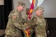 Photo of Col. Kilgore passing the unit colors to Sergeant Major Alkire.