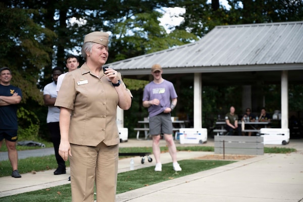 Capt. Darla Dietrich, commanding officer, Navy Medicine Readiness and Training Command Bethesda address’s the officers and crew of NMRTC Bethesda during the 2026 NMRTC Bethesda Captain’s Cup at Walter Reed National Military Medical Center, July 31, 2026. NMRTC Bethesda's mission is to maximize warfighter performance through optimized medical readiness tailored to operational requirements, enhance the readiness of the medical force to sustain expeditionary medical capability, and train and develop the Navy Medicine Force. (U.S. Navy photo by Mass Communication Specialist 2nd Class Alec Kramer)