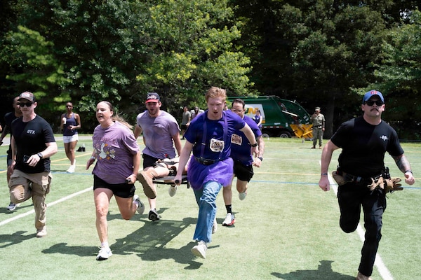 Sailors assigned to Navy Medicine Readiness and Training Command Bethesda, participate in the 2026 NMRTC Bethesda Captain’s Cup at Walter Reed National Military Medical Center, July 31, 2026. NMRTC Bethesda's mission is to maximize warfighter performance through optimized medical readiness tailored to operational requirements, enhance the readiness of the medical force to sustain expeditionary medical capability, and train and develop the Navy Medicine Force. (U.S. Navy photo by Mass Communication Specialist 2nd Class Alec Kramer)