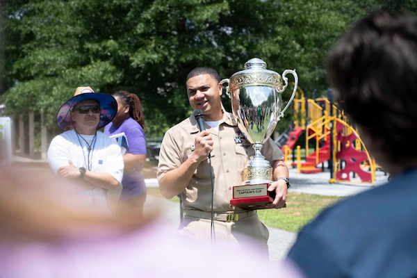 Command Master Chief Aaron Paul, Navy Medicine Readiness and Training Command Bethesda announces the winning team of the 2026 NMRTC Bethesda Captain’s Cup at Walter Reed National Military Medical Center, July 31, 2026. NMRTC Bethesda's mission is to maximize warfighter performance through optimized medical readiness tailored to operational requirements, enhance the readiness of the medical force to sustain expeditionary medical capability, and train and develop the Navy Medicine Force. (U.S. Navy photo by Mass Communication Specialist 2nd Class Alec Kramer)