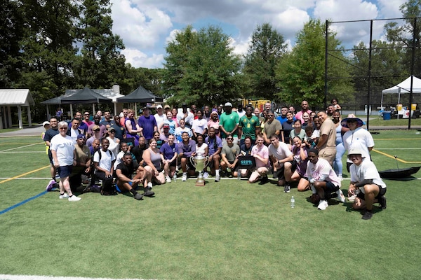 Sailors assigned to Navy Medicine Readiness and Training Command Bethesda, with Capt. Darla Dietrich, commanding officer, NMRTC Bethesda and Command Master Chief Aaron Paul, after the 2026 NMRTC Bethesda Captain’s Cup at Walter Reed National Military Medical Center, July 31, 2026. NMRTC Bethesda's mission is to maximize warfighter performance through optimized medical readiness tailored to operational requirements, enhance the readiness of the medical force to sustain expeditionary medical capability, and train and develop the Navy Medicine Force. (U.S. Navy photo by Mass Communication Specialist 2nd Class Alec Kramer)
