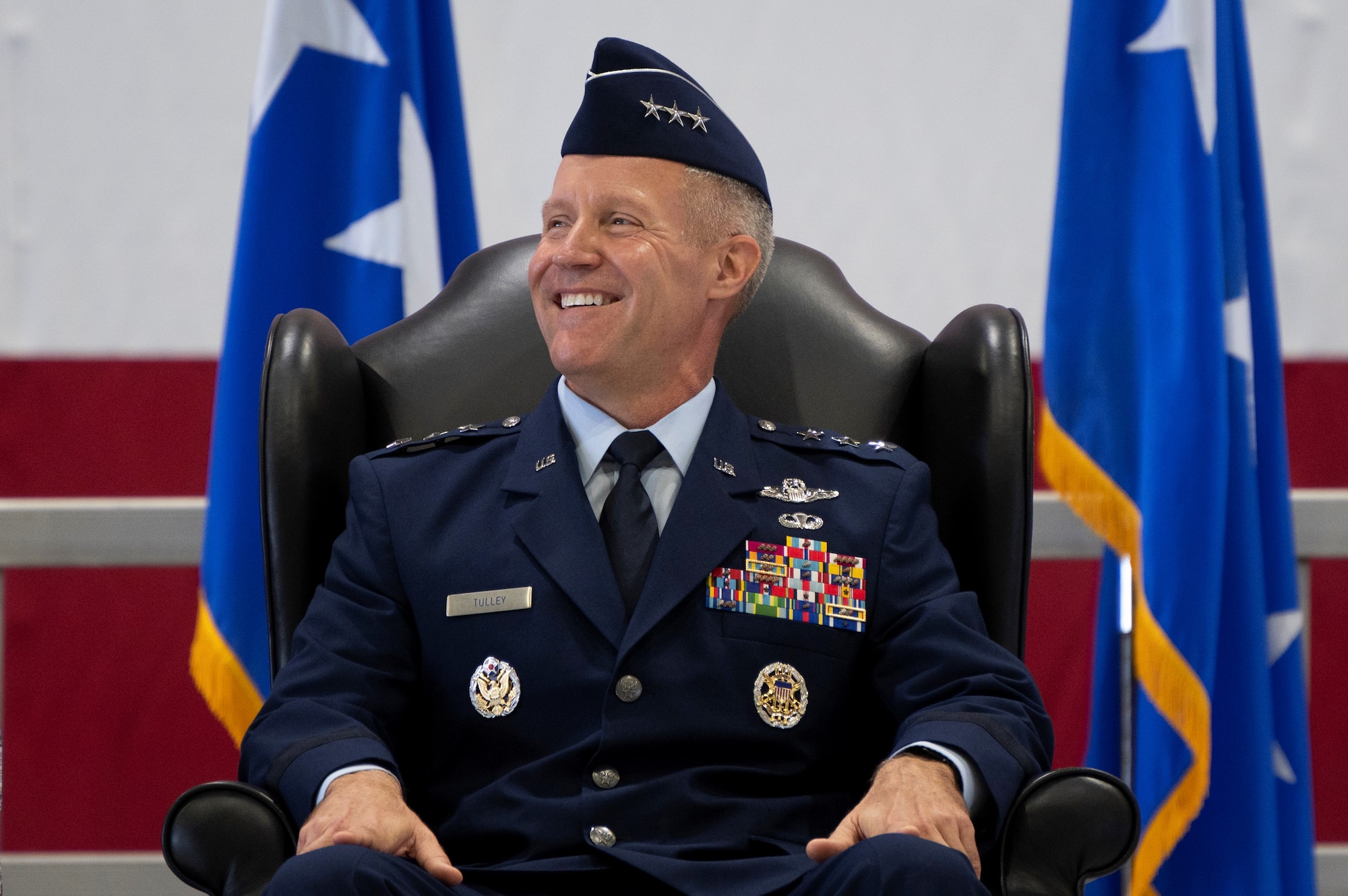 U.S. Air Force Lt. Gen. Daniel H. Tulley laughs during a speech at the AMC Assumption of Command ceremony on Scott Air Force Base, Illinois, August 3, 2026. Tulley assumed command of AMC, leading nearly 107,000 Total Force Airmen and more than 1,100 aircraft dedicated to delivering Rapid Global Mobility that enables the Joint Force to rapidly deploy, sustain and maneuver combat power across the globe. (U.S. Air Force photo by Tech. Sgt. Dalton Williams)
