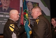 U.S. Army Command Sgt. Maj. Christopher Prosser, the incoming U.S. Army Noncommissioned Officer Academy commandant, receives the USANCOA guidon from Maj. Gen. Trevor Bredenkamp,