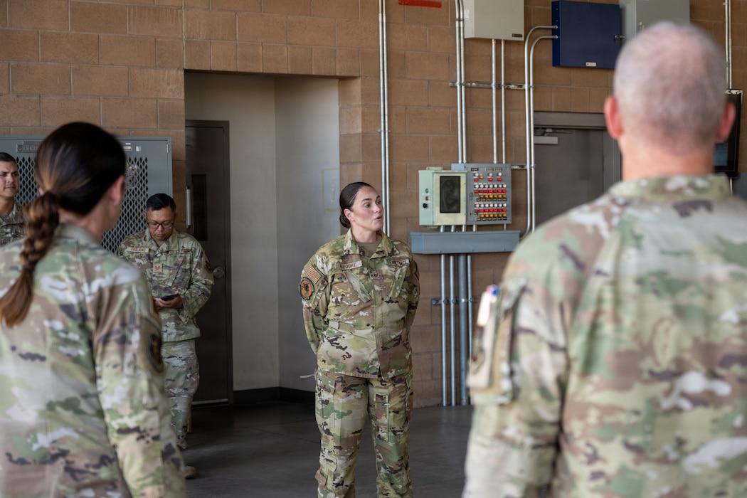 Airman recognizes two Airmen.