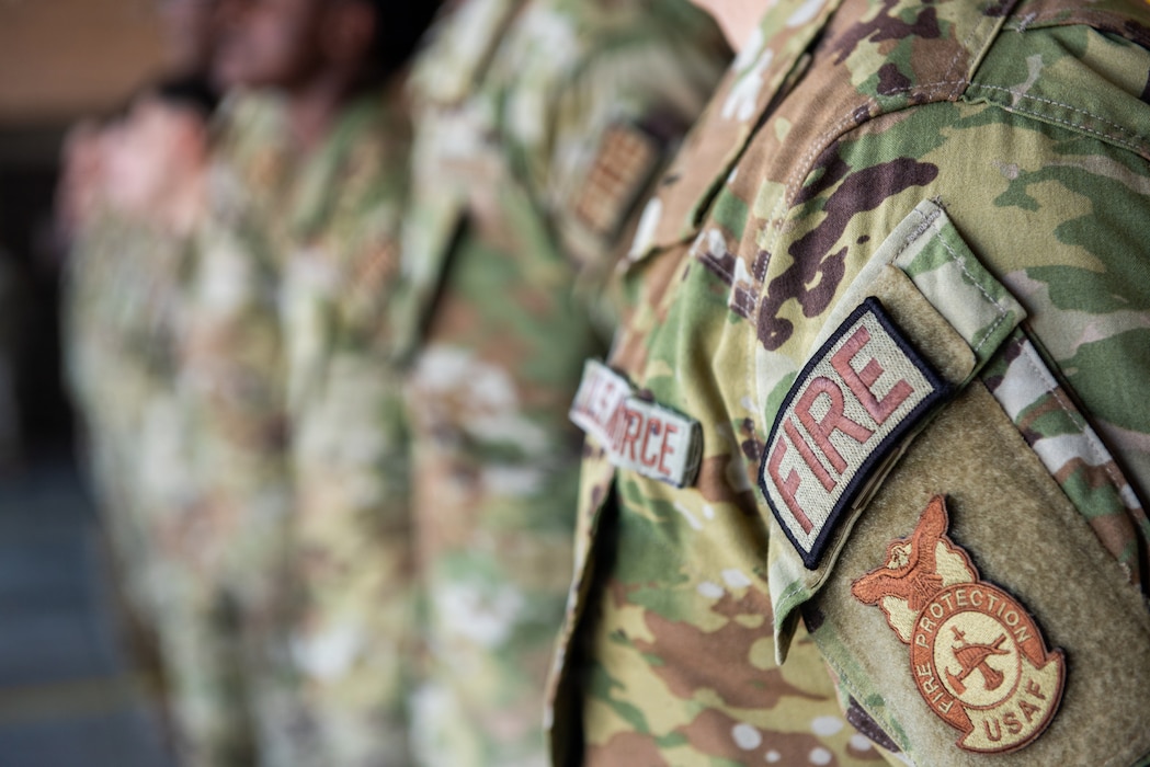 A patch is displayed on an Airman's uniform.