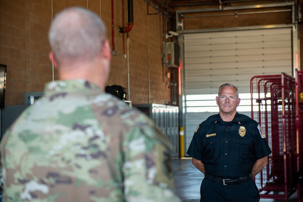 Commander speaks to an Airman.