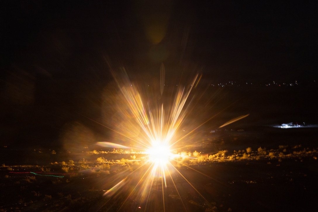 U.S. Marines with 2nd Battalion, 5th Marine Regiment, 1st Marine Division, use a M159 white star cluster for signaling during night live-fire company attacks as part of Service Level Training Exercise 4-26 at Range 410A, Marine Corps Air Ground Combat Center, Twentynine Palms, California, July 21, 2026. SLTE is a premier training event that ensures the Marine Corps remains a highly lethal, adaptable force capable of dominating the future multi-domain fight. (U.S. Marine Corps photo by Lance Cpl. Lainey Brummett)