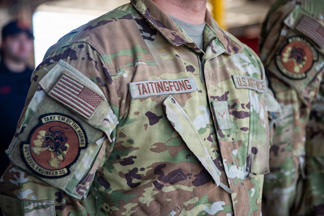 Airman stands at parade rest.