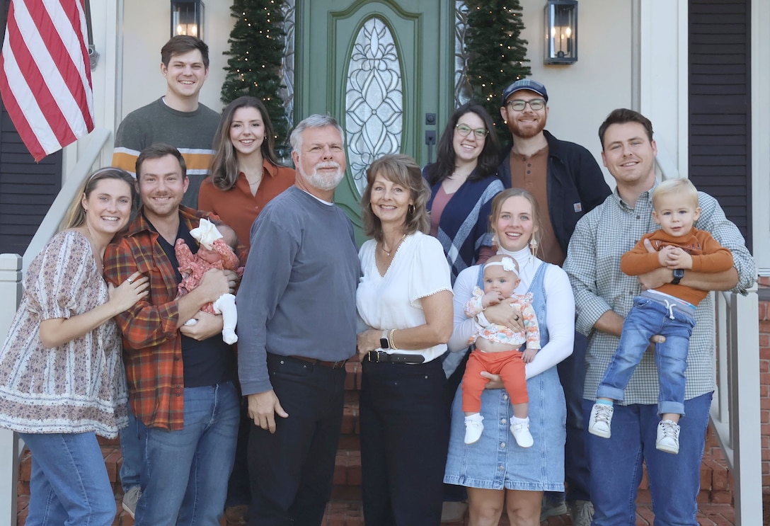 Timothy "Jay" Caldwell II, U.S. Army Corps of Engineers, Mobile District cost engineer, back row right, and his wife, Brittany, pose with the rest of the Caldwell family for a family Christmas photo in Spanish Fort, Alabama, December 25, 2025. Caldwell and his wife, Brittany, are expecting their first child, Clarence John Caldwell, in January 2027. (Courtesy photo)