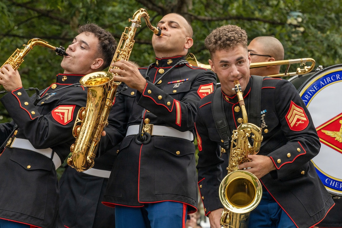 U.S. Marine Corps Cpl. Julian Garcia, from Florida, left, GySgt. Daniel Melendez, from Puerto Rico, middle, and Sgt. David Zehrung, from Wisconsin, musicians with 2nd Marine Aircraft Wing Band perform during the 49th annual Sturgis Falls Celebration at Cedar Falls, Iowa June 27, 2026. The 2nd MAW Band took part in the celebration to strengthen community relations and reaffirm the history, customs, and traditions representative of the Marine Corps. (U.S. Marine Corp photo by Pfc. Keani Guthmueller)
