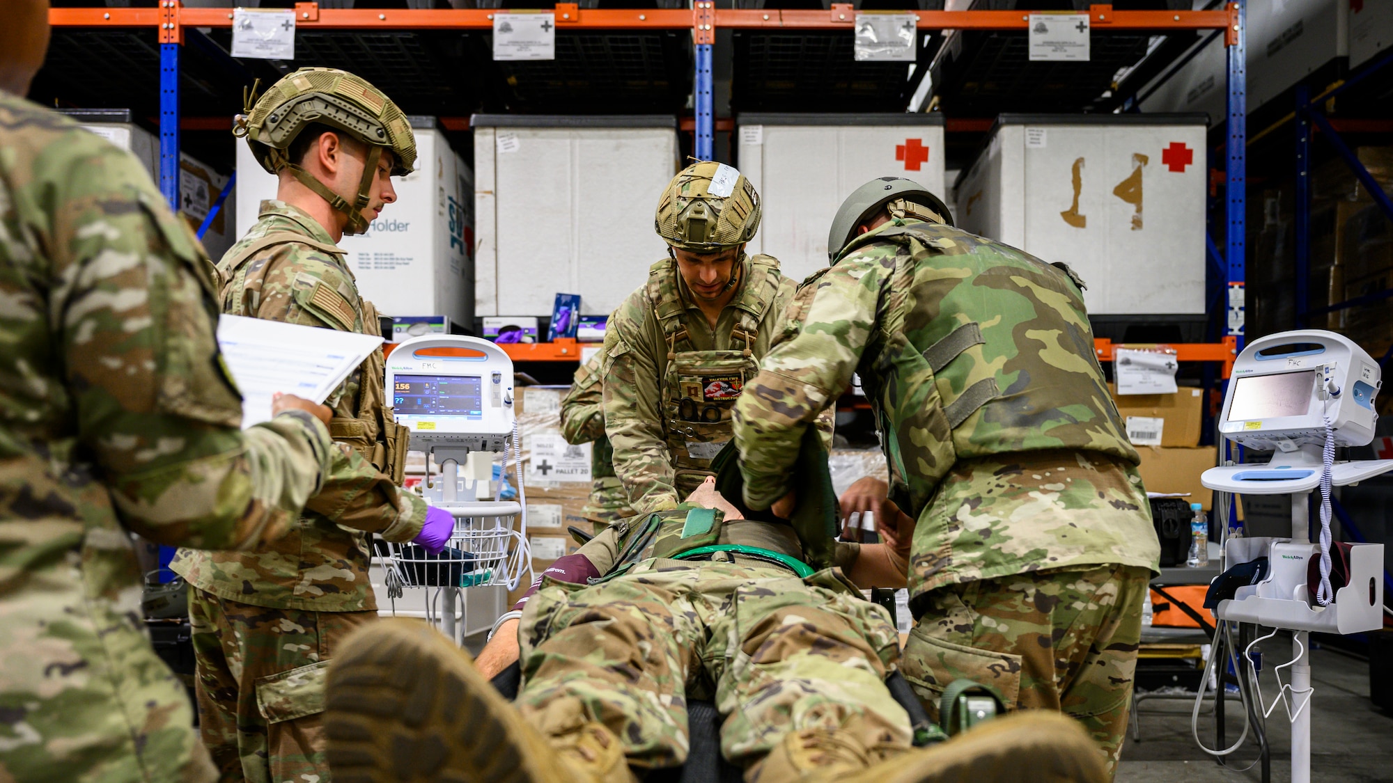 U.S. Air Force medical personnel assigned to the 18th Medical Group assess the injuries of a simulated patient following a notional attack during an En-Route Patient Staging System exercise as part of Beverly Beach 26-1 at Kadena Air Base, Japan, Aug. 4, 2026. The training strengthened the 18th Medical Group's ability to provide expeditionary medical care and support patient movement during contingency operations. (U.S. Air Force photo by Airman 1st Class Francisco Huerta)