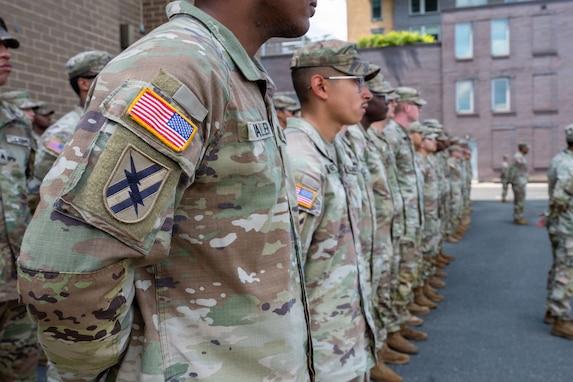 Georgia National Guardsmen assigned to Joint Task Force-District of Columbia (JTF-DC) in support of the DC Safe and Beautiful mission, stand in formation during a recognition ceremony in Crystal City, Va., July 31, 2026. About 5000 National Guard members are supporting the mission, providing critical assistance to the Metropolitan Police Department to help ensure the safety of residents, commuters, and visitors throughout the District. (U.S. Army National Guard photo by Sgt. Alex Lopez)