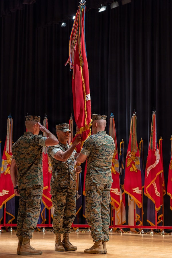 U.S. Marine Corps Lt. Gen. Calvert L. Worth Jr., center, the offgoing commanding general of II Marine Expeditionary Force, transfers the colors to Lt. Gen. Robert C. Fulford, the oncoming commanding general, during the II MEF Change of Command ceremony at Marine Corps Base Camp Lejeune, North Carolina, Aug. 4, 2026. The change of command ceremony symbolizes the passing of authority and responsibility from the offgoing to the oncoming commanding officer. (U.S. Marine Corps photo by Lance Cpl. Ethan Claassen)