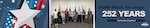 A group of people stand together posing for a picture