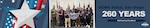 A group stands together to pose for a picture