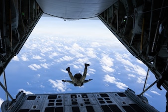 A Philippine Marine Corps member jumps out of a U.S. Marine Corps KC-130J Hercules aircraft assigned to Marine Aerial Refueler Transport Squadron (VMGR) 153 during military free fall jump training as a part of Exercise Rim of the Pacific 2026 above Marine Corps Base Hawaii, July 17, 2026.