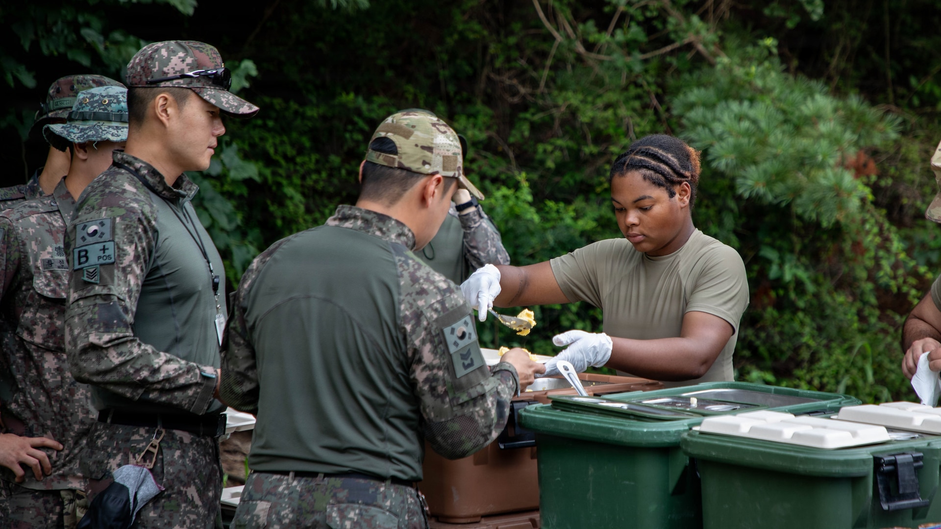 U.S. Army Pfc. Kayla Aikens, right, assigned to the 581st Field Feeding Company, 2nd Infantry Division, serves meals during a Combined Field Feeding Training Exercise at Rodriguez Live Fire Complex, South Korea, July 27, 2026.