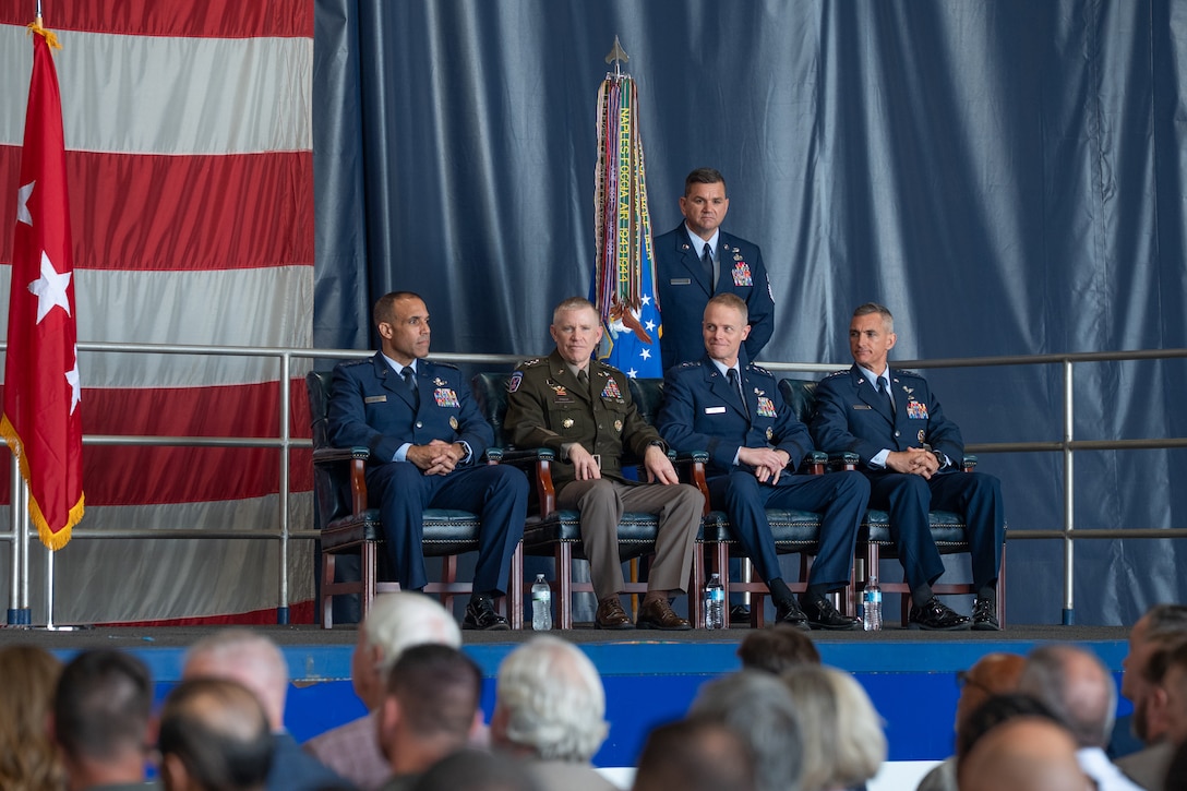 U.S. Air Force Gen. Adrian Spain, commander of Air Combat Command, U.S. Army Lt. Gen. Patrick Frank, deputy commander of U.S. Central Command, U.S. Air Force Lt. Gen. Derek France, outgoing U.S. Air Forces Central outgoing commander and U.S. Air Force Lt. Gen. Daniel T. Lasica, U.S. Air Forces Central incoming commander, listen to the master of ceremonies during a change of command ceremony at Shaw Air Force Base, South Carolina, Aug. 4, 2026.