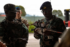 Ghana Armed Forces representatives inspect a drone during a showcase of unmanned aircraft systems innovation, technical management and production capabilities hosted by the U.S. Army Southern European Task Force, Africa, at the 173rd Mobile Brigade Combat Team’s Bayonet Innovation Team drone lab on Caserma Del Din in Vicenza, Italy, July 22, 2026. The visit gave the Ghanaian delegation a firsthand look at how the U.S. Army designs, builds and maintains small unmanned aircraft at the tactical level, including the brigade’s in-house production. The exchange also advanced a partnership that provides insight into operating drones in extreme heat, informing U.S. system design and supporting readiness and lethality in different environments. The engagement complements the Africa Multidomain Training and Experimentation Center effort in Morocco, a U.S. Africa Command and Morocco initiative to help standardize drone proficiency and shared operational understanding among African nations. (U.S. Army photo by Staff Sgt. Catessa Palone)