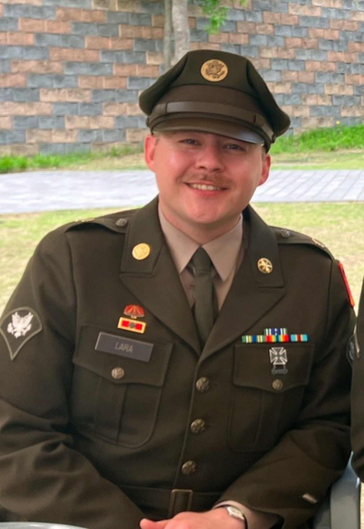 U.S. Army Spc. Arturo Lara, 35th Air Defense Artillery Brigade fire direction center battle systems operator, was one of the off-duty U.S. Airmen and Soldiers who sprang into action after a bus overturned, assisting injured passengers until emergency services arrived.