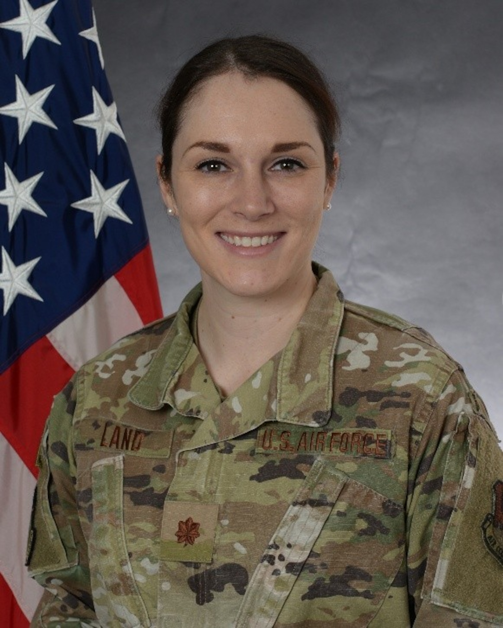U.S. Air Force Maj. Tessa Land, 6th Intelligence Squadron director of operations, was one of the off-duty U.S. Airmen and Soldiers who sprang into action after a bus overturned, assisting injured passengers until emergency services arrived.