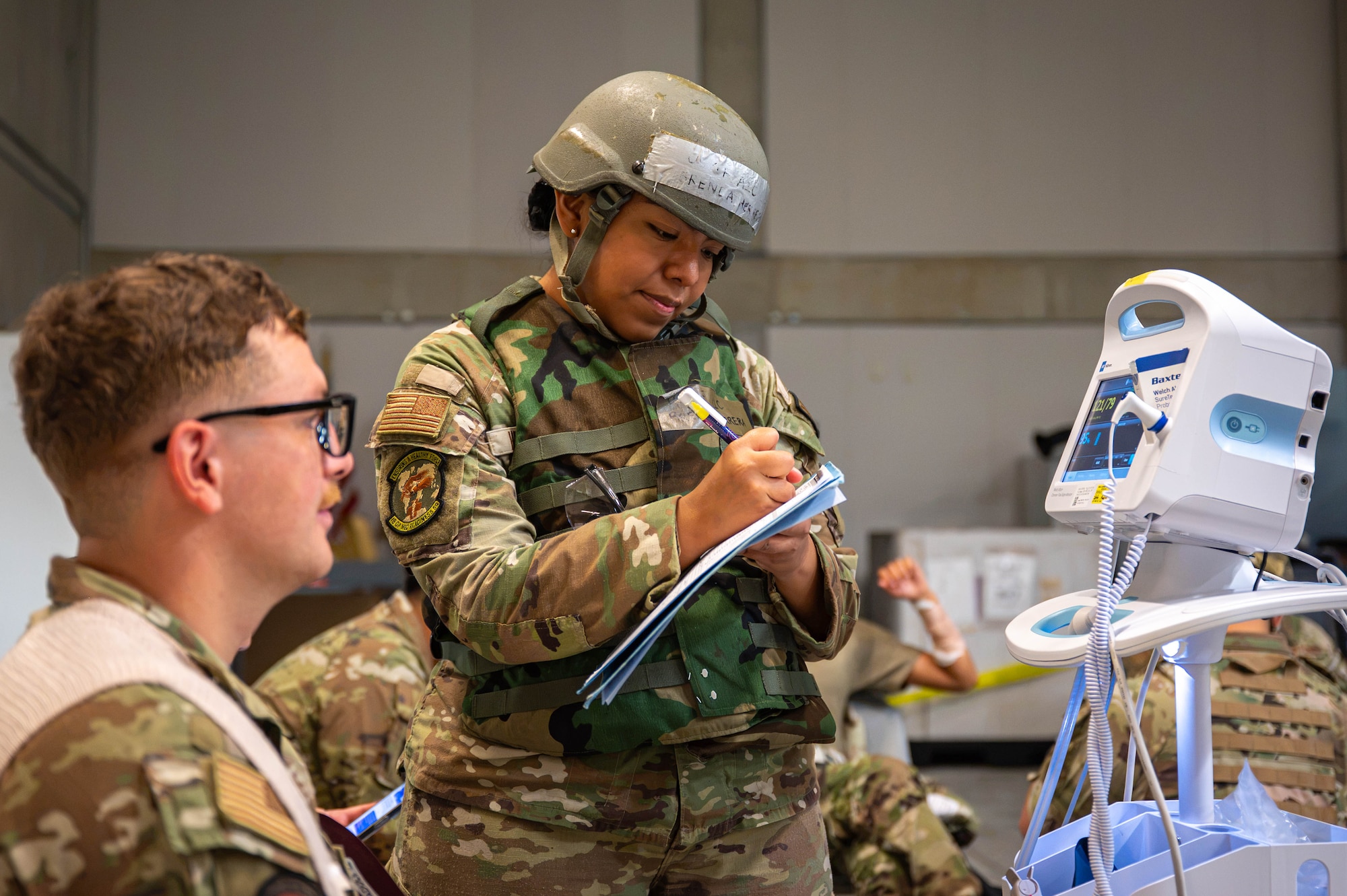 Service member assesses a simulated patient.