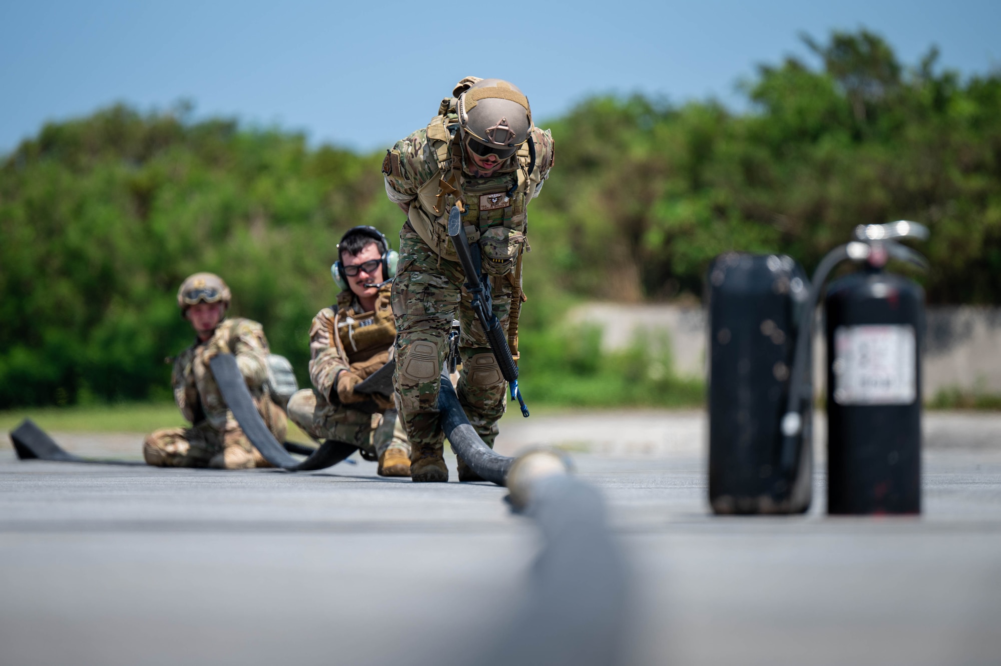 U.S. Air Force Airmen assigned to the 18th Logistics Readiness Squadron, squeegee excess fuel from a hose during a forward arming and refueling point operation on a U.S. Air Force MC-130J assigned to Kadena Air Base during readiness exercise Beverly Beach 26-1 at Kadena AB, Japan, Aug. 4, 2026. Exercises and operations incorporating agile combat employment concepts ensure forward-deployed forces in the Indo-Pacific are ready to protect and defend the United States, allied and partner interests at a moment’s notice. (U.S. Air Force photo by Airman 1st Class Nathaniel Jackson)