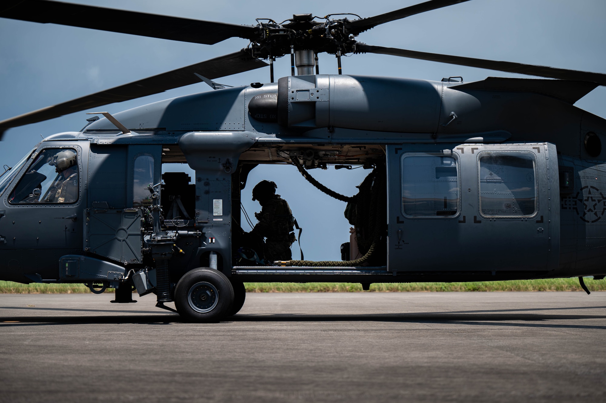 U.S. Air Force special mission aviators assigned to the 33rd Rescue Squadron complete a hot-gas refueling operation on a U.S. Air Force HH-60W Jolly Green II during readiness exercise Beverly Beach 26-1 at Kadena Air Base, Japan, Aug. 4, 2026. Rapid aircraft turnaround strengthens the 18th Wing's ability to sustain airpower and respond to evolving operational requirements across the Indo-Pacific. (U.S. Air Force photo by Airman 1st Class Nathaniel Jackson)