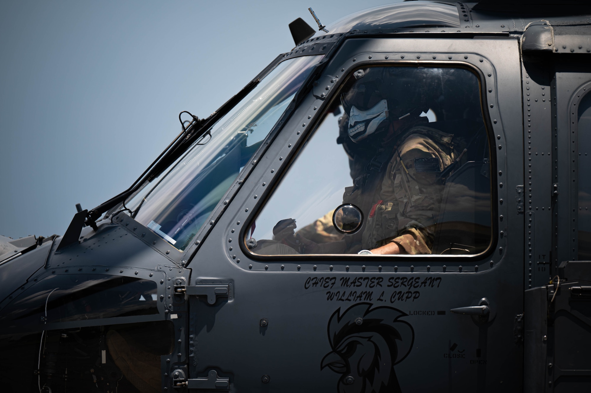 U.S. Air Force Capt. Tyler Wright, 33rd Rescue Squadron HH-60W Jolly Green II pilot, remains at the controls while U.S. Air Force special mission aviators assigned to the 33rd Rescue Squadron refuel a U.S. Air Force HH-60W Jolly Green II during a hot-gas refueling operation as part of readiness exercise Beverly Beach 26-1 at Kadena Air Base, Japan, Aug. 4, 2026. BB26-1 provides Airmen opportunities to refine expeditionary operations and strengthen the 18th Wing's ability to generate combat airpower in contested environments. (U.S. Air Force photo by Airman 1st Class Nathaniel Jackson)