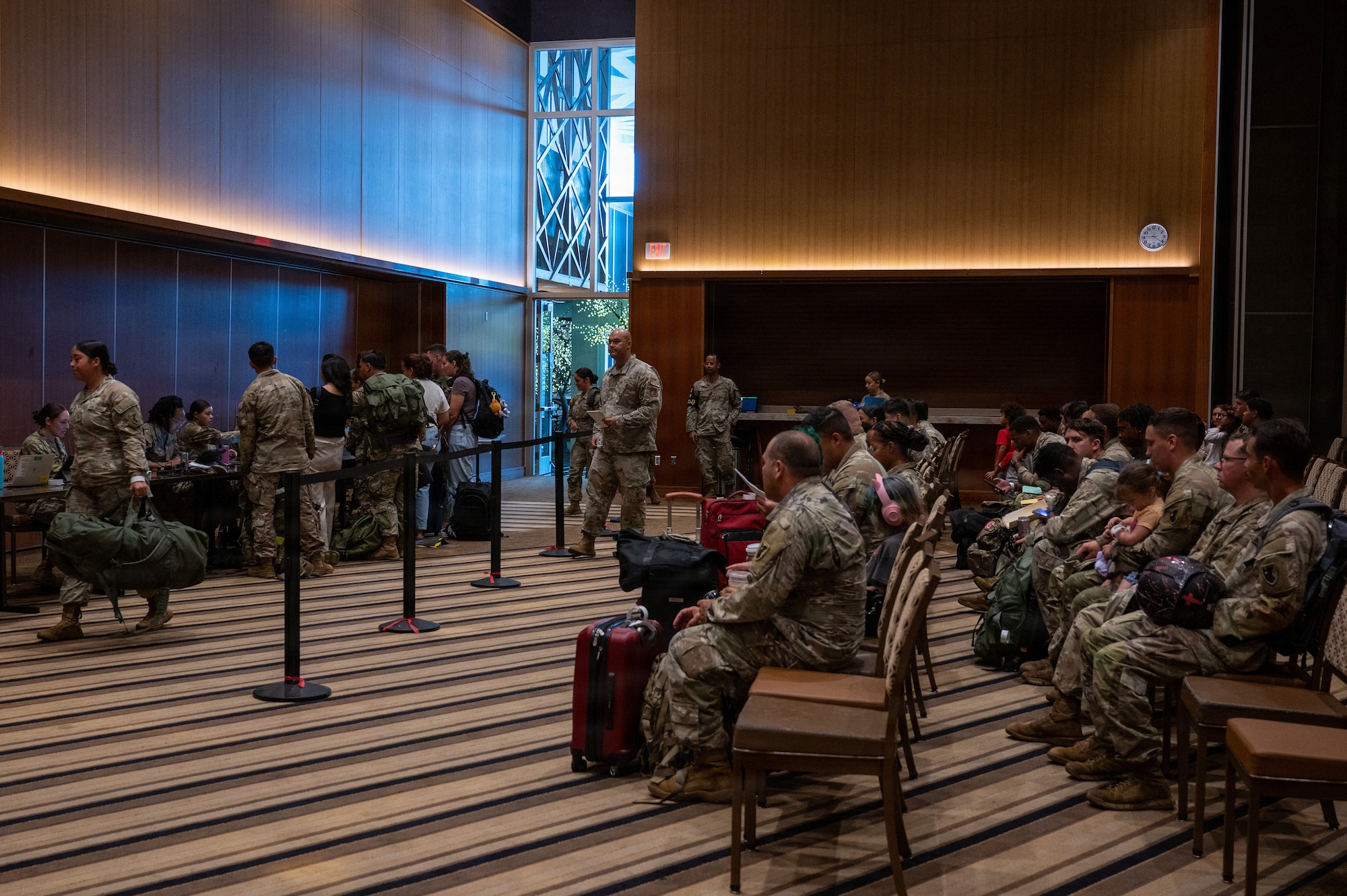 U.S. service members and dependents assigned to the 18th Wing participate in a simulated military assisted departure training during readiness exercise