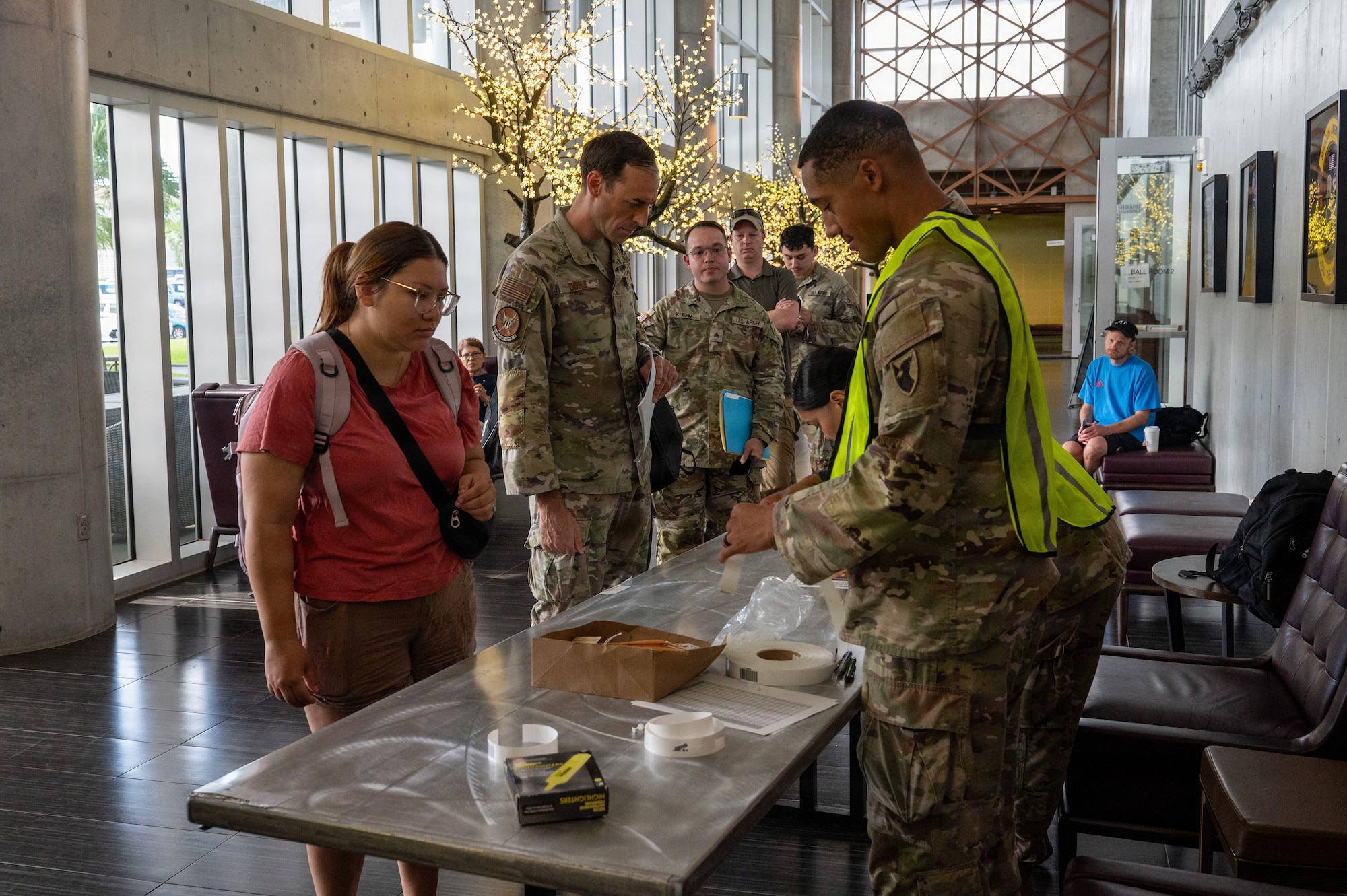 U.S. service members and dependents assigned to the 18th Wing participate in a simulated military assisted departure training during