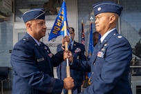 Air Force Brig. Gen. Phillip L. Mallory, Hawaii Air National Guard commander, passes the Headquarters Hawaii Air National Guard Recruiting and Retention Flight guidon to Air Force Lt. Col. Michael Buendia, Headquarters Hawaii Air National Guard Recruiting Flight commander, symbolizing Buendia's acceptance of command of the flight during the unit's activation ceremony held at Pearl Highlands Center in Pearl City, Hawaii, Aug. 1, 2026.