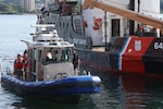 Members of the 51st Civil Support Team, Michigan National Guard, U.S. Coast Guard, and other responders are on the St. Marys River during the culminating training event for Operation Iron Wave at the Soo Locks in Sault Ste. Marie, Michigan. Operation Iron Wave is an interagency training exercise that prepares local, state and federal agencies to respond to threats against critical infrastructure. Photo by Capt. Cameron McPhail.