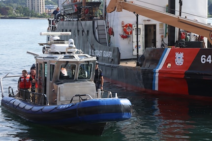 Members of the 51st Civil Support Team, Michigan National Guard, U.S. Coast Guard, and other responders are on the St. Marys River during the culminating training event for Operation Iron Wave at the Soo Locks in Sault Ste. Marie, Michigan.
