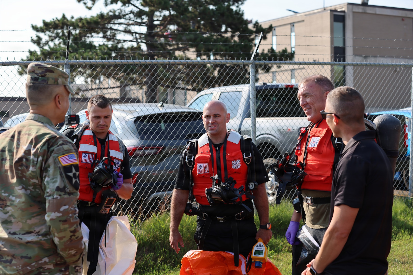 Brig. Gen. Ravi Wagh, assistant adjutant general - Army, Michigan National Guard, talks to members of the 51st Civil Support Team, Michigan National Guard, and other responders prior to the culminating training event for Operation Iron Wave at the Soo Locks in Sault Ste. Marie, Michigan.