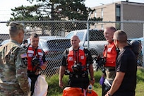 Brig. Gen. Ravi Wagh, assistant adjutant general - Army, Michigan National Guard, talks to members of the 51st Civil Support Team, Michigan National Guard, and other responders prior to the culminating training event for Operation Iron Wave at the Soo Locks in Sault Ste. Marie, Michigan.