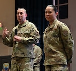 Col. Joshua N. Garrison, 960th Cyberspace Wing commander, and CMSgt Warisar Villarreal, 960th CW command chief, provide opening remarks during the Sixteenth Air Force/960th CW All Call at JBSA-Lackland, Texas on June 7, 2026. The leaders emphasized the significant strides of organizational maturity of the wing followed by awards to Airmen for their accomplishments.