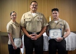 Navy Medicine Training Support Center (NMTSC), Detachment Camp Lejeune held a ceremony on July 23, 2026, honoring its latest students from the Surgical Technology Program (Phase II). Hospital Corpsman Second Class Emely Betancourt and Hospital Corpsman Second Class Caue Uemura received their certificates of completion, presented by Hospital Corpsmen First Class Christopher River, leading petty officer for NMTSC Detachment Camp Lejeune.
Pictured left to right: Hospital Corpsman Second Class Emely Betancourt, Hospital Corpsman First Class Christopher Rivera, and Hospital Corpsman Second Class Caue Uemura.