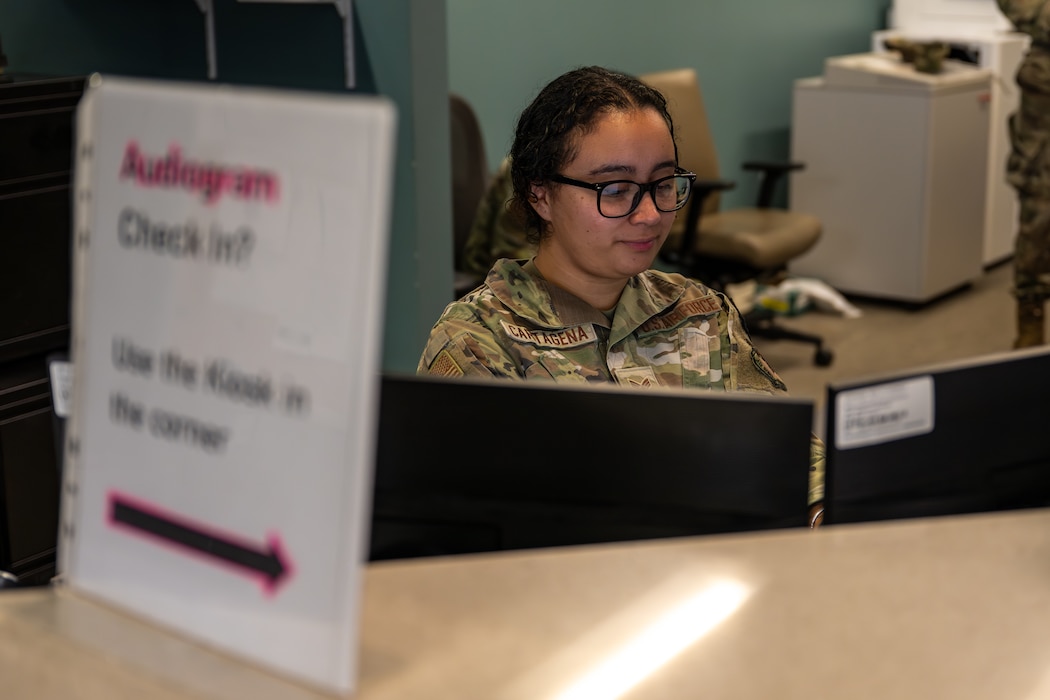 Airman working at a desk.