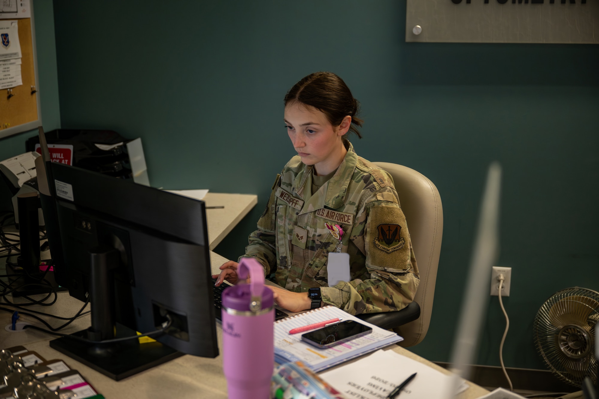 Airman walking on the desk.