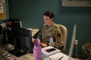Airman walking on the desk.