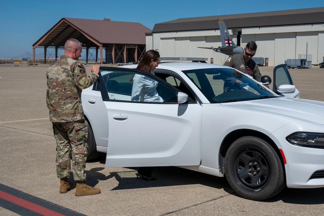 Chief Master Sergeant of the Air Force David R. Wolfe and Irish Wolfe enter a chase car at Beale Air Force Base, Calif., Aug. 3, 2026.