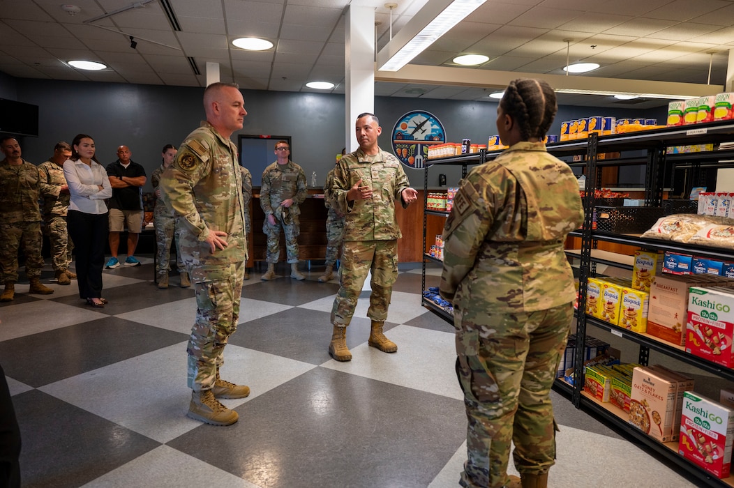 Master Sgt. Gilbert Hernandez, 9th Operations Group first sergeant, and Master Sgt. Shakuntala Johnson, 9th Physiological Support Squadron first sergeant, brief Chief Master Sergeant of the Air Force David R. Wolfe about the Airman’s Market at Beale Air Force Base, Calif., Aug. 3, 2026.