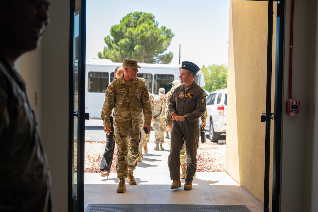 Chief Master Sergeant of the Air Force David R. Wolfe and Lt. Col. Brandon Olson, 9th Reconnaissance Wing chief of staff, walk into the Valley Chapel at Beale Air Force Base, Calif., Aug. 3, 2026.