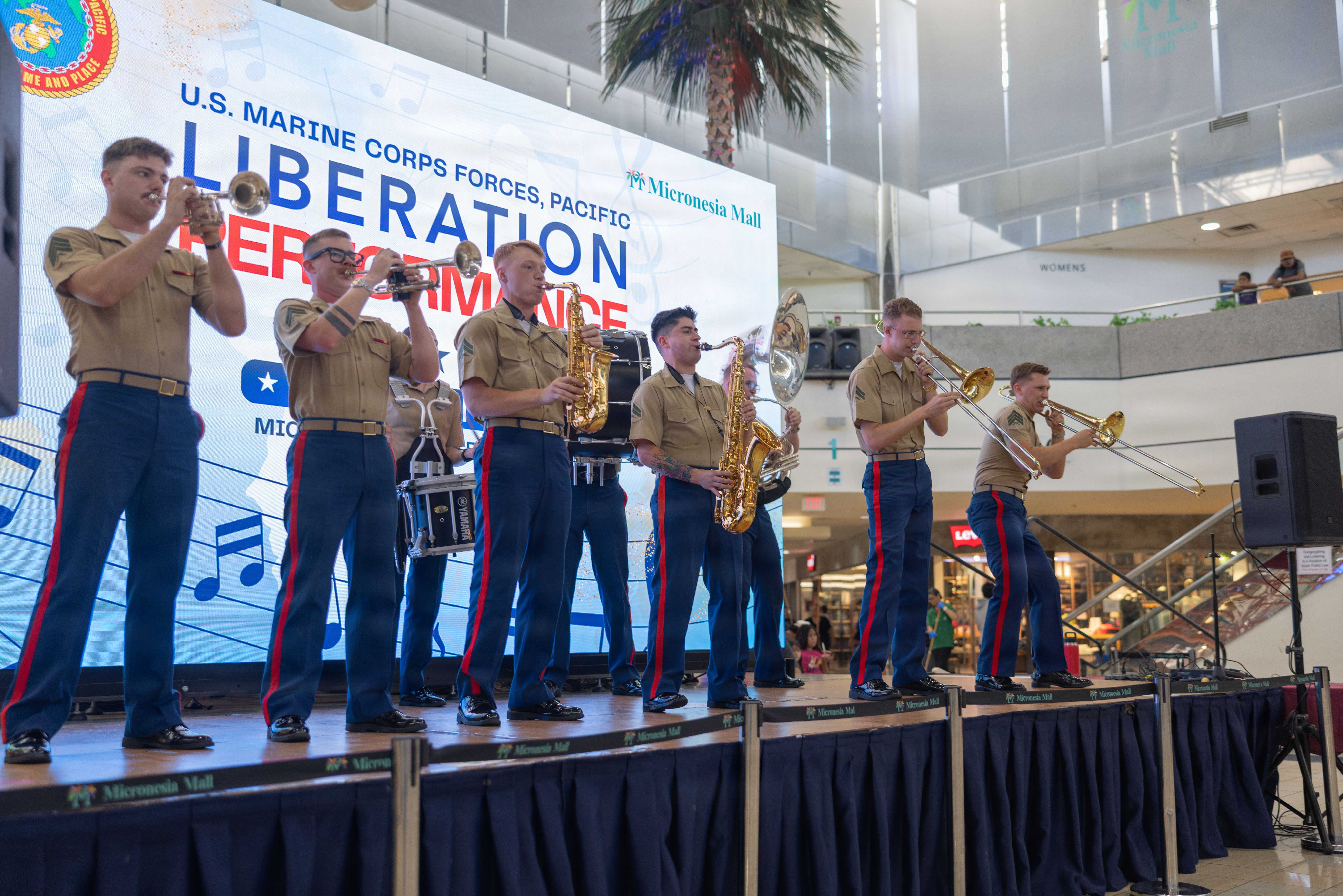 U.S. Marines with the Marine Corps Forces Pacific Band perform during a concert in celebration of the 82nd Liberation Day anniversary at the Micronesian Mall, Dededo, Guam, July 20, 2026. Guam commemorated the 82nd Liberation Day events and performances as a solemn reminder to honor the courage and sacrifice of the American service members and the resilience of the CHamoru people during the imperial Japanese occupation and liberation of the island by U.S. armed forces during World War II. (U.S. Marine Corps photo by Pfc. Jayden Martinez)