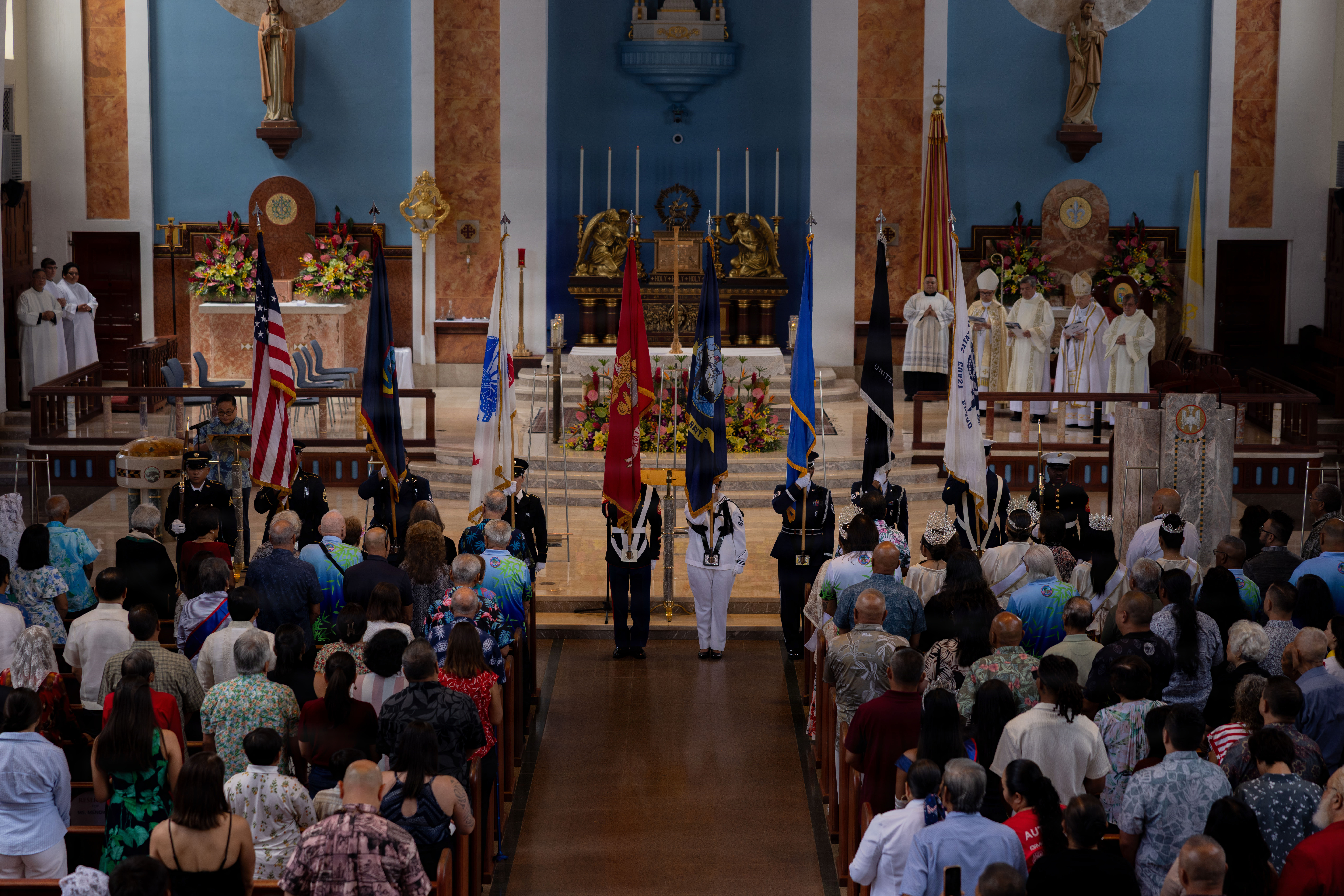 The Joint Region Marianas joint force color guard present the colors during the 82nd Guam Liberation Day ceremony at Dulce Nombre De Maria Cathedral-Basilica, Hagåtña, Guam, July 21, 2026. Guam commemorated the 82nd Liberation Day mass as a solemn reminder to honor the courage and sacrifice of the American service members and the resilience of the CHamoru people during the imperial Japanese occupation and liberation of the island by U.S. armed forces during World War II. (U.S. Marine Corps photo by Pfc. Jayden Martinez)