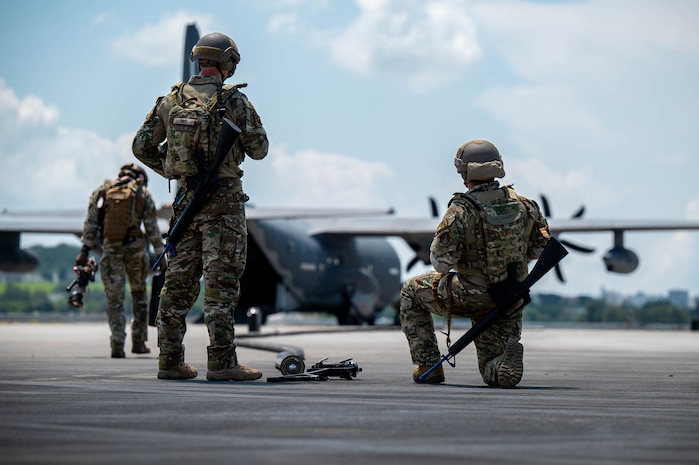 U.S. Air Force Airmen assigned to the 18th Logistics Readiness Squadron, prepare a fuel hose during a forward arming and refueling point operation on a U.S. Air Force MC-130J assigned to Kadena Air Base during readiness exercise Beverly Beach 26-1 at Kadena AB, Japan, Aug. 4, 2026. FARP operations enable Airmen to rapidly refuel aircraft, reducing ground time and increasing operational readiness in support of agile combat operations. (U.S. Air Force photo by Airman 1st Class Nathaniel Jackson)
