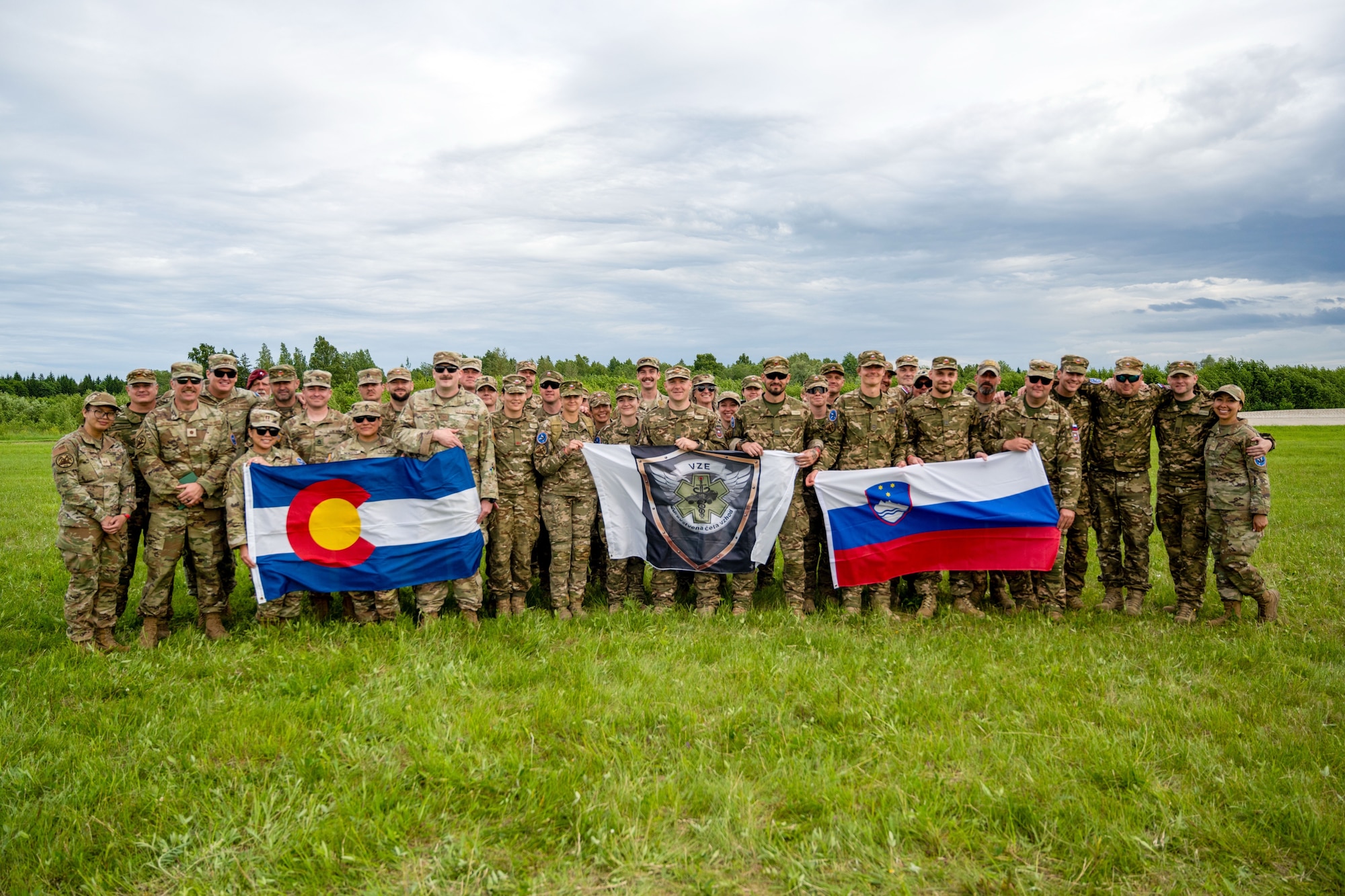 Medical personnel from the Colorado National Guard’s Chemical, Biological, Radiological, and Nuclear Enhanced Response Force Package pose for a photo alongside their counterparts from the Slovenian Medical Forces at the Vigorous Warrior Exercise, Tapa, Estonia, June 18, 2026. VW is NATO’s multinational medical exercise that trains military medical support with a strong focus on interoperability, medical readiness, and cooperation between civilian and military medical systems. (U.S. Air National Guard photo by 2nd Lt. Stephanie Zimmerman)