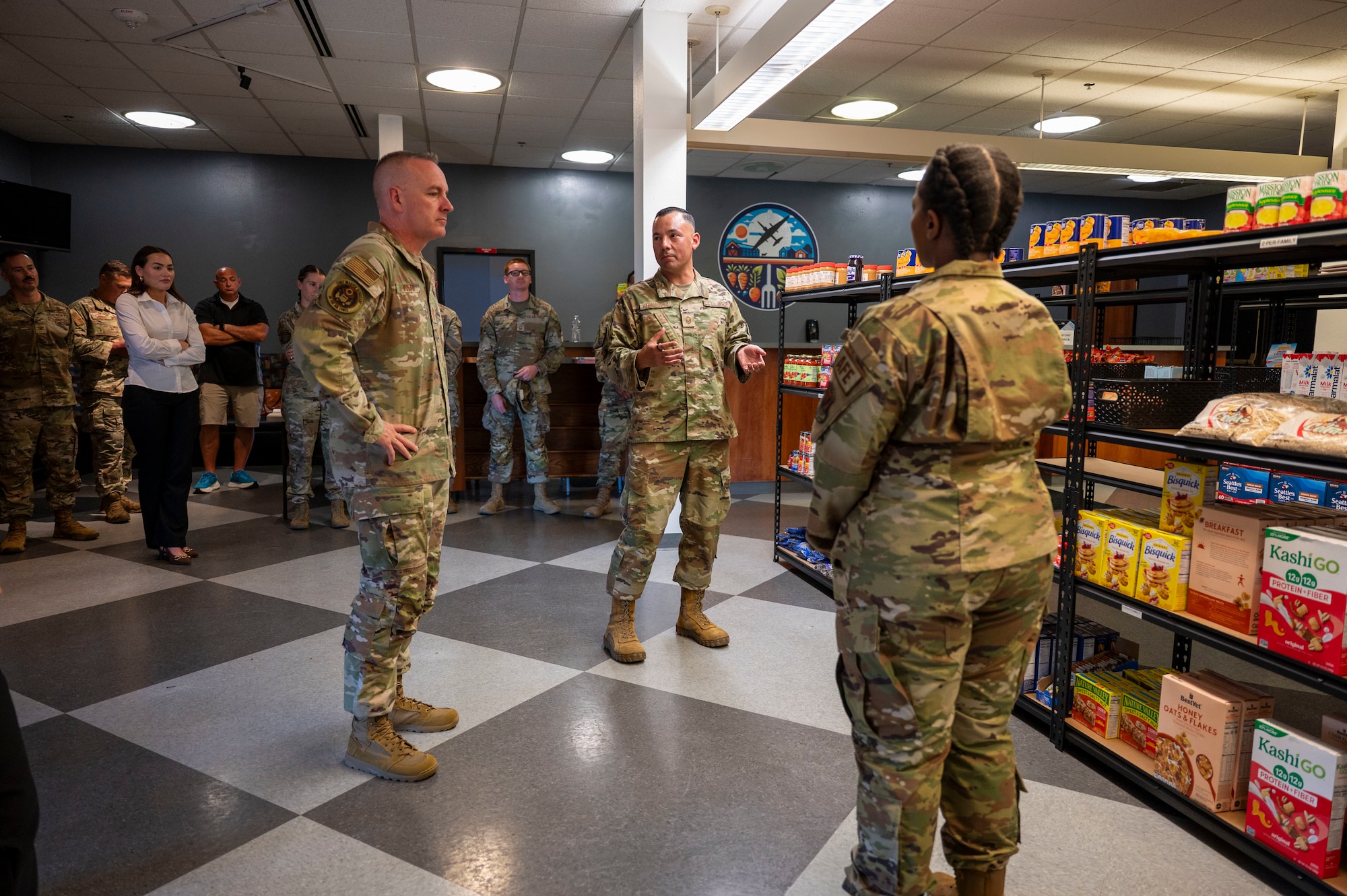 Master Sgt. Gilbert Hernandez, 9th Operations Group first sergeant, and Master Sgt. Shakuntala Johnson, 9th Physiological Support Squadron first sergeant, brief Chief Master Sergeant of the Air Force David R. Wolfe about the Airman’s Market at Beale Air Force Base, Calif., Aug. 3, 2026.