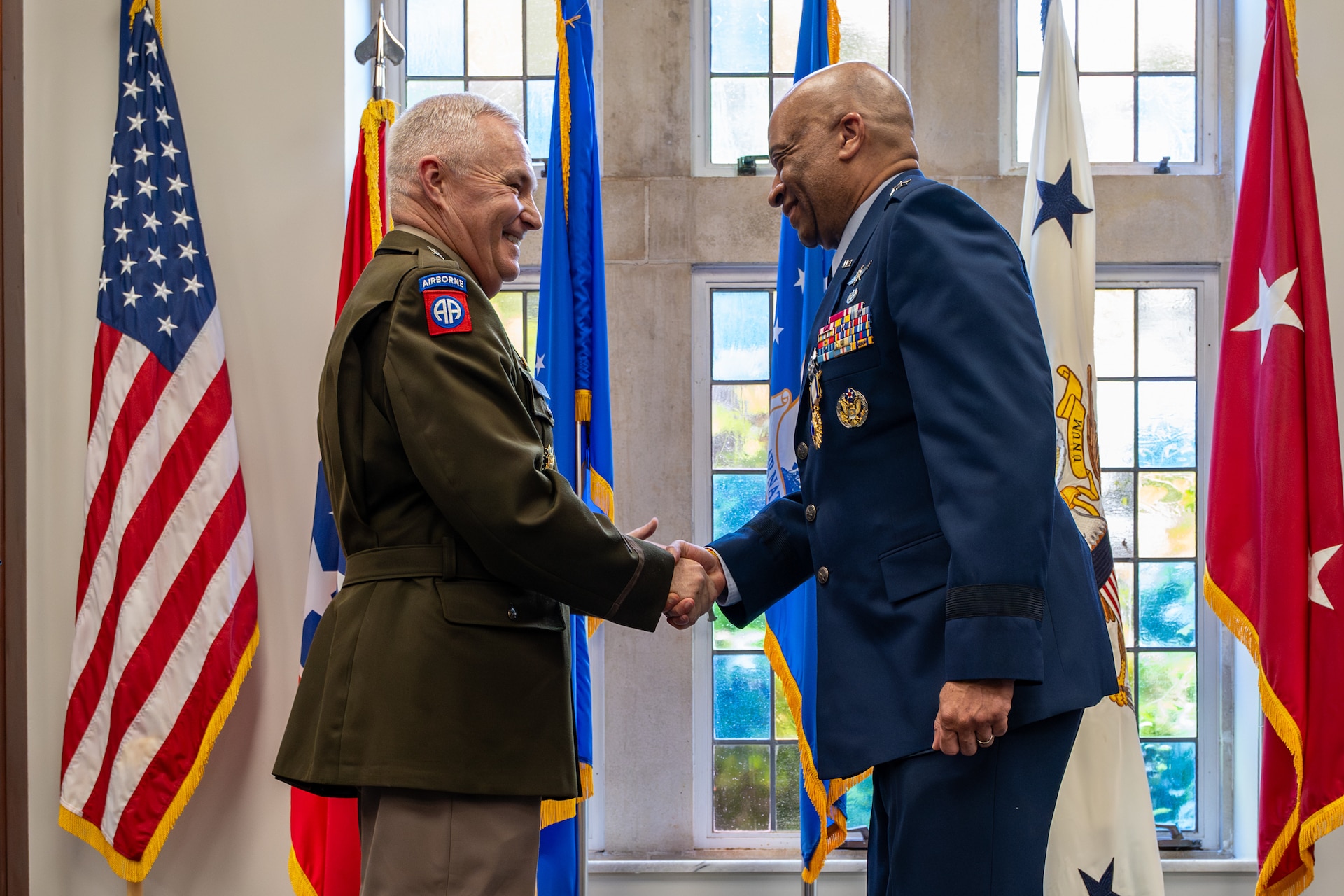 U.S. Army Maj. Gen. Haldane Lamberton, left, adjutant general of the Kentucky National Guard, congratulates U.S. Air Force Maj. Gen. Charles Walker, Air National Guard assistant to the judge advocate general of the United States Air Force, after presenting him with an Air Force Distinguished Service Medal during a ceremony in Nashville, Tenn., July 24, 2026. Walker is concluding a distinguished 35-year career during which he previously served as director of the Office of Complex Investigations at the National Guard Bureau in Washington, D.C., chief of staff for the Air Component at Joint Force Headquarters—Kentucky National Guard, and staff judge advocate for the Kentucky Air Guard’s 123rd Airlift Wing in Louisville. (U.S. Air National Guard photo by Dale Greer)